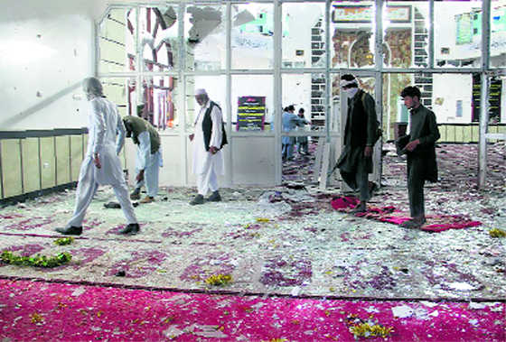 Burqa-clad bombers kill  29 inside Shia mosque
