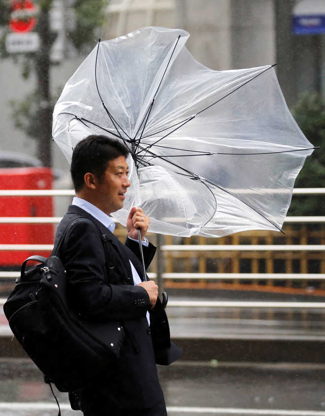 Tokyo unscathed as weakening typhoon brushes by, heads north