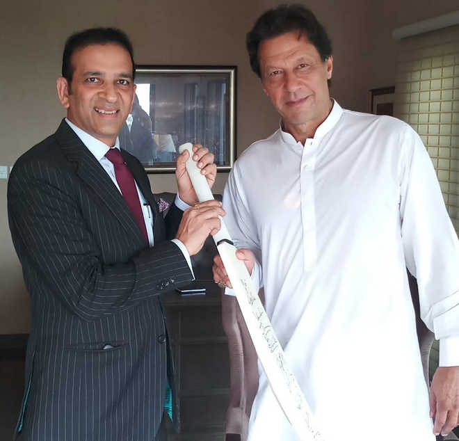 Indian envoy meets Imran Khan, gifts bat signed by Indian team