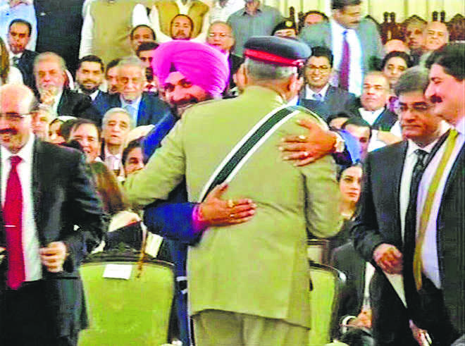 Sidhu embraces Pak army chief, BJP says embarrassing