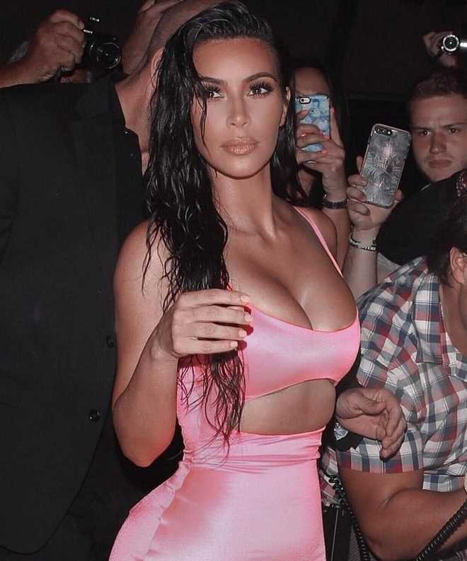 Kim Kardashian shows off curves in neon thong