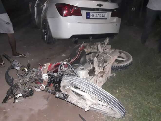 Man, son killed as car hits bike