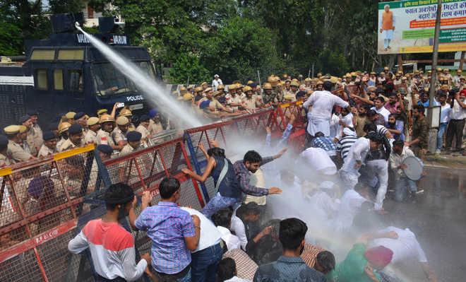 Chandigarh police use water cannons to disperse the crowd
