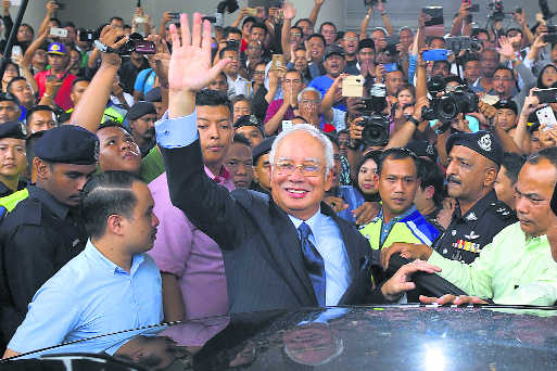 Najib hit with 25 new charges