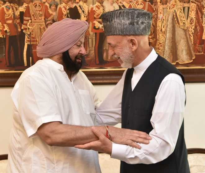 CM meets Karzai, offers support to Afghanistan