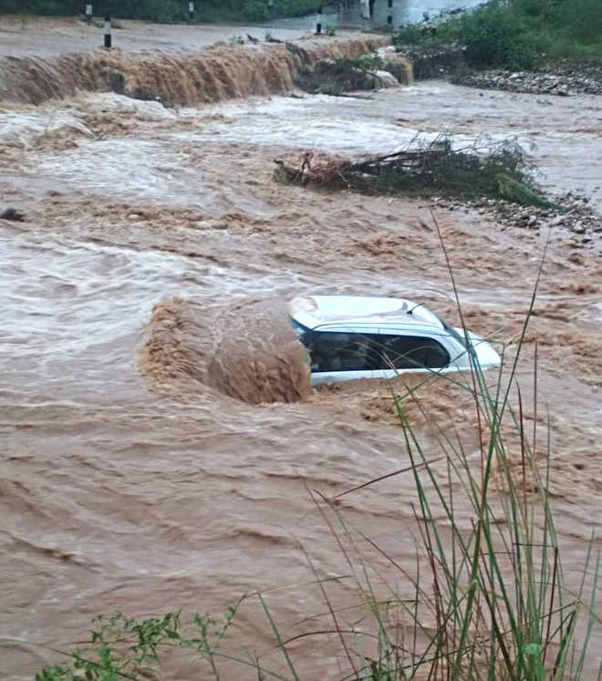Car swept away, 6 of family rescued