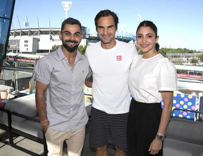 Kohli, wife Anushka meet tennis star Federer at Australian Open