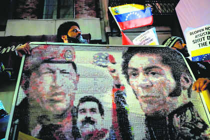 Backed by military, Maduro hits back at rival