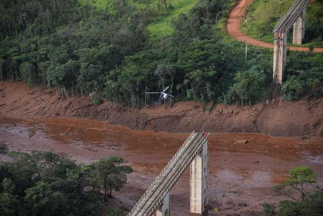 Hundreds missing after Vale dam burst at Brazil mine, 7 bodies found