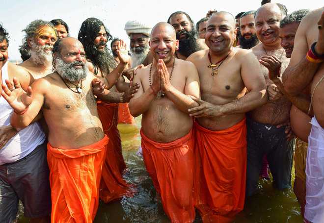 Adityanath, ministers take dip in Sangam during Kumbh Mela