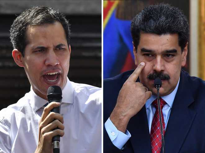 Venezuela power struggle heats up with Guaido curbs, protest plans