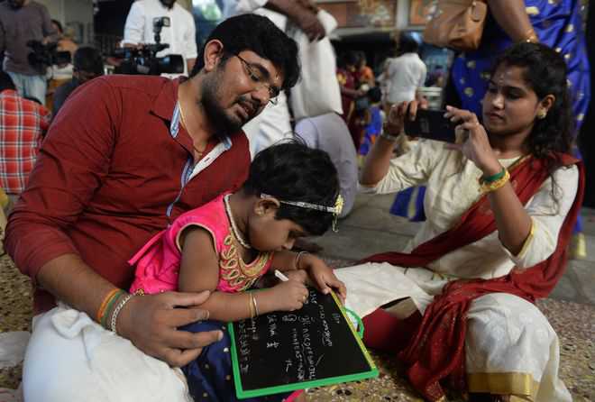 Kerala children initiated into world of letters