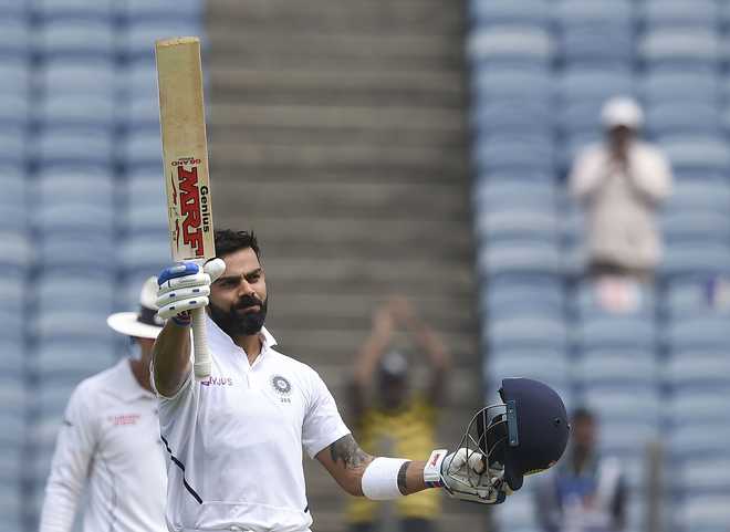 Kohli scores double hundred as India take control of Pune Test