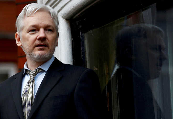 Assange remanded in custody after brief UK court hearing