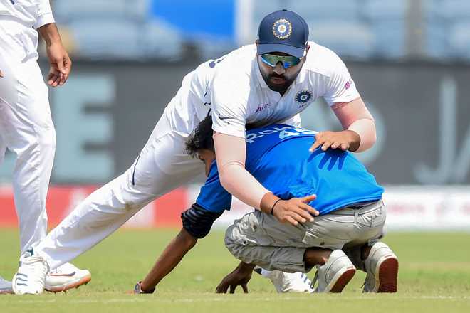 Rohit Sharma trips as fan tries to touch his feet, Twitter erupts
