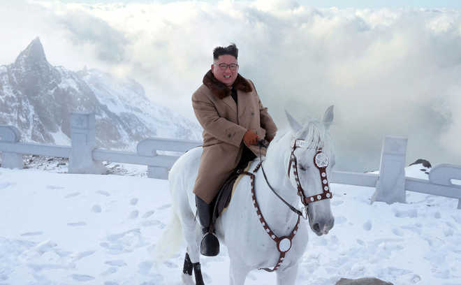''Defiant message'' as Kim rides white horse on sacred mountain