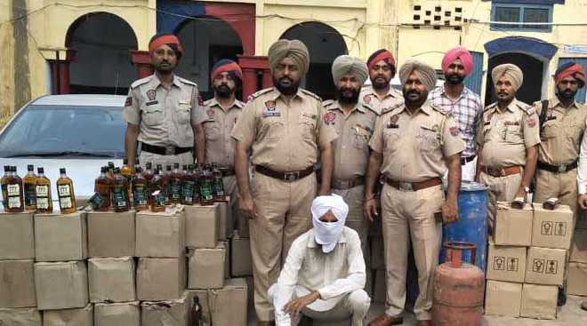One held with 95 cases of liquor