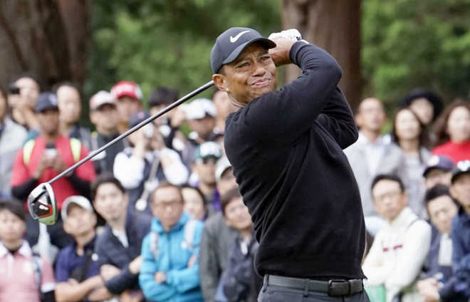Woods, Woodland share Rd 1 lead in Japan