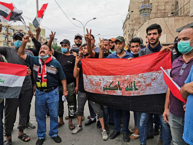 Iraq protesters march towards Baghdad’s Green Zone, one killed