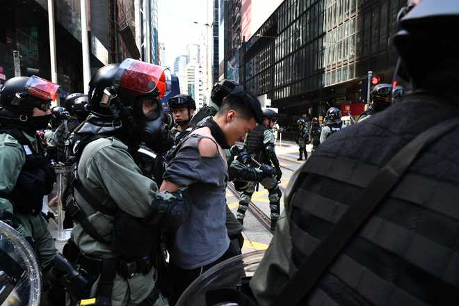 Hong Kong police shoot protester, man set on fire