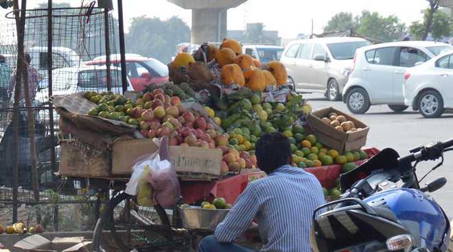 Street vendors fume at hiked composition fee