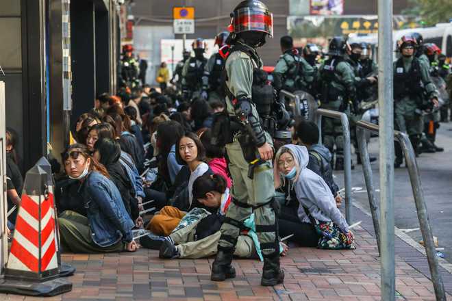 Choking and crying, Hong Kong protesters pinned back on university campus