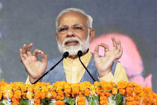 PM attacks Mamata over dharna, says won''t spare perpetrators of chit fund scams