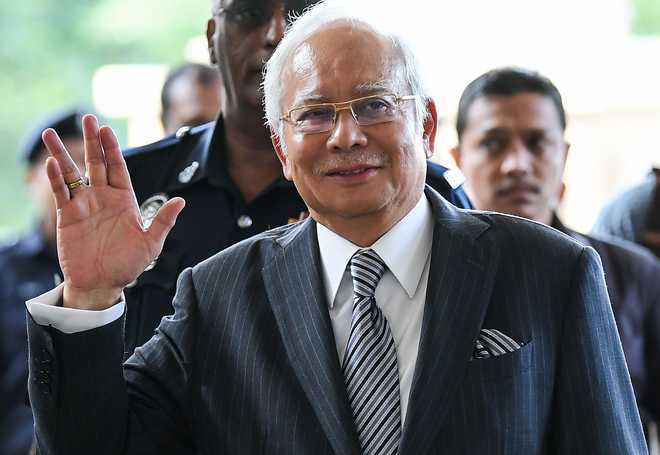 Malaysia''s ex-PM Najib gears up for graft trial with charm offensive