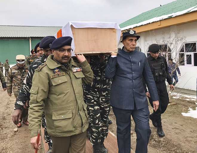 Rajnath Singh helps carry coffin of slain CRPF jawan