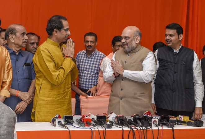 Shiv Sena climbs down on demands, announces alliance with BJP
