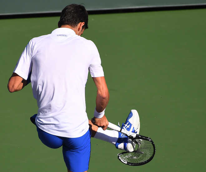 Djokovic stunned, Rafa, Federer advance