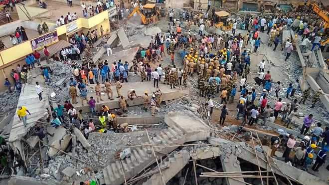 Two killed, many trapped in building collapse at Dharwad