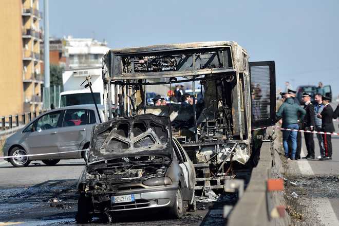 Italian driver hijacks, torches school bus carrying dozens of children