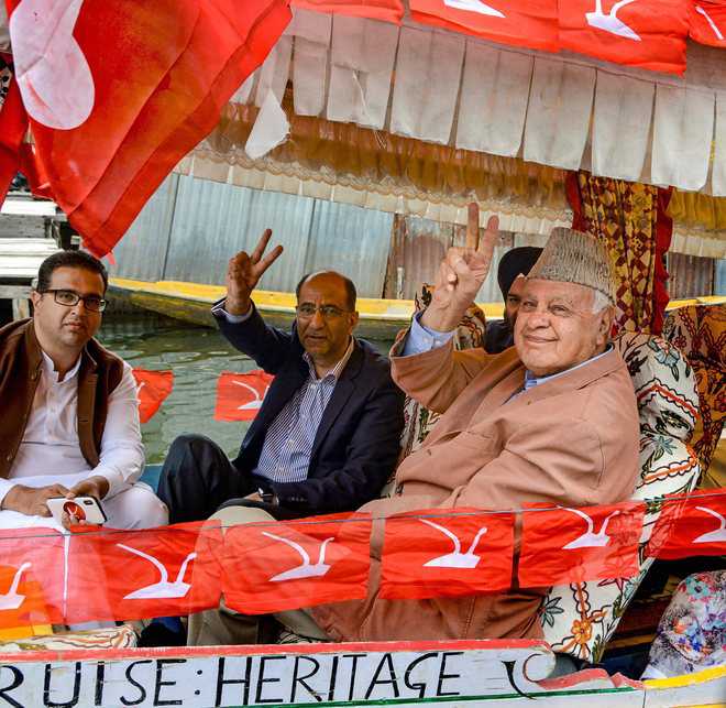 Farooq holds boat rally at Dal Lake in Srinagar