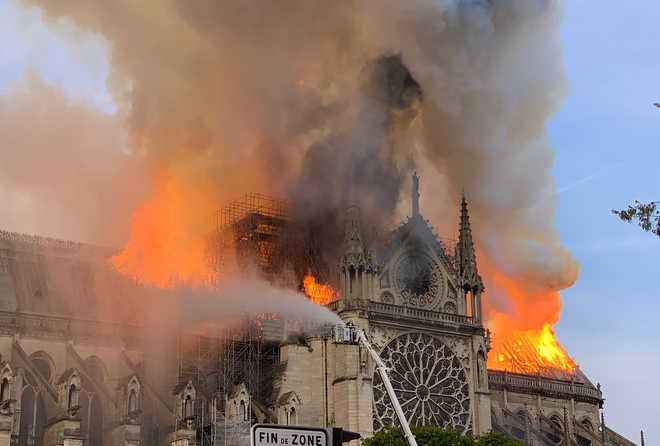 Fire ravages 850-yr-old Notre-Dame cathedral in Paris, spire collapses