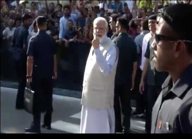 Prime Minister Narendra Modi casts vote at polling booth in Ahmedabad