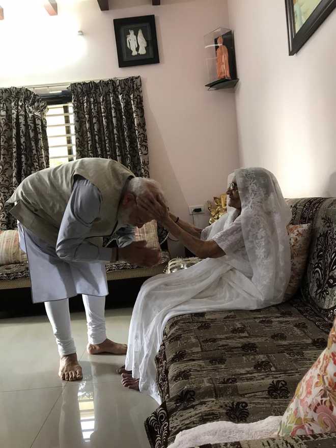 Prime Minister Narendra Modi meets mom; gets shawl, sweets, coconut with blessings