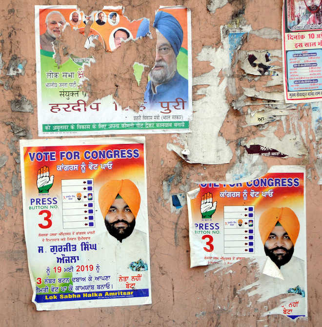 Elections end, political posters continue to deface walls in city