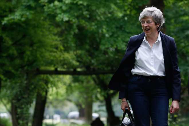 British PM May calls Modi on poll win, discusses G20, ICC World Cup
