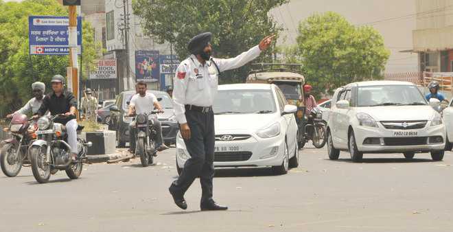 Uphill task for cops to regulate traffic in scorching heat