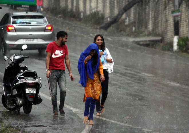Rain, gusty winds provide relief from scorching heat