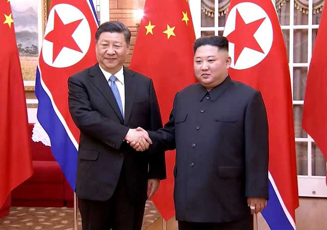 North Korea woos Chinese President Xi in lavish state visit