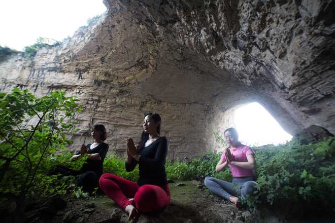 Yoga enthusiasts across the world perform asanas to mark International Yoga Day