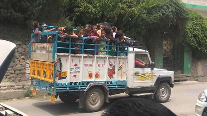 Huddled into pick-up, students ferried to tournament venue in Banjar