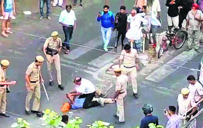 Image result for delhi police beating sikh