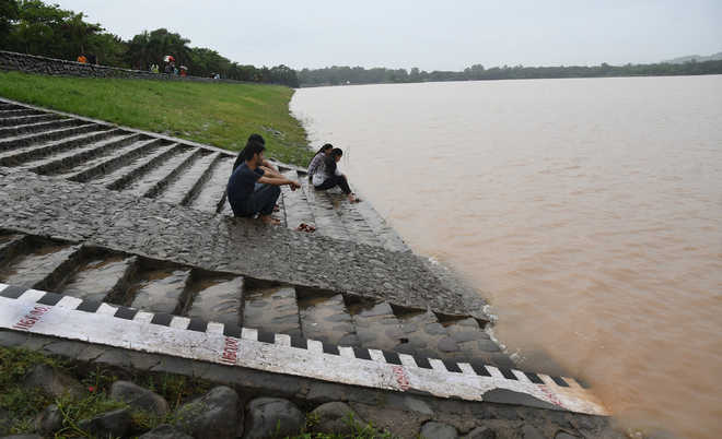 Rain floods low-lying areas, disrupts power