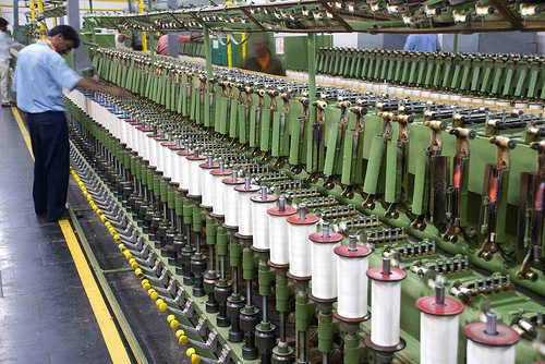Textile spinning mills mull cutting on production