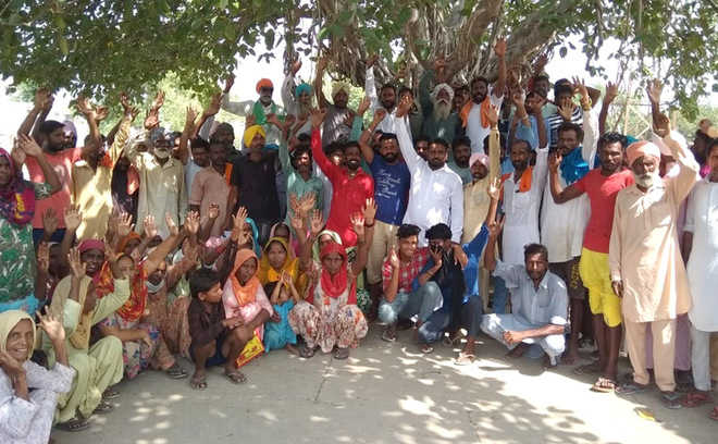 Residents of Mehma Sarja village protest against sarpanch
