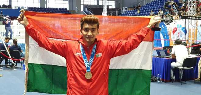 Thapa wins gold in new weight category