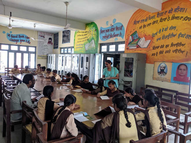Staff, villagers pitch in to give school facelift, students upbeat